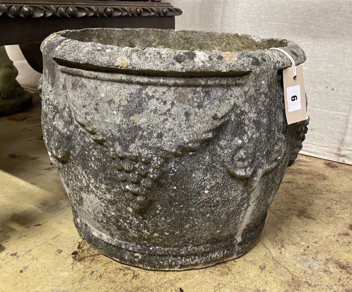 A circular reconstituted stone garden planter, diameter 38cm, height 30cm